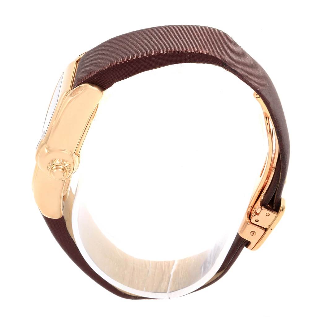 The Cartier Roadster W62018Y5 Women's Yellow Gold Silver Dial W62018Y5 Women's Yellow Gold Silver Dial watch is shown from a side angle, highlighting the watch case, crown, and a portion of the strap.