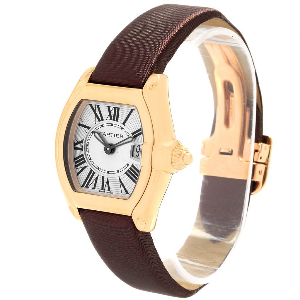 The image shows a Cartier Roadster W62018Y5 Women's Yellow Gold Silver Dial W62018Y5 Women's Yellow Gold Silver Dial watch angled to feature the face, case, crown, and strap.