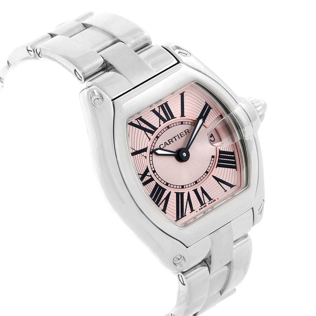 The image displays a Cartier Roadster W62017V3 Women
s Stainless Steel Pink Dial W62017V3 Women
s Stainless Steel Pink Dial watch focused on its face, bezel, and part of the metal bracelet at an angled side view.