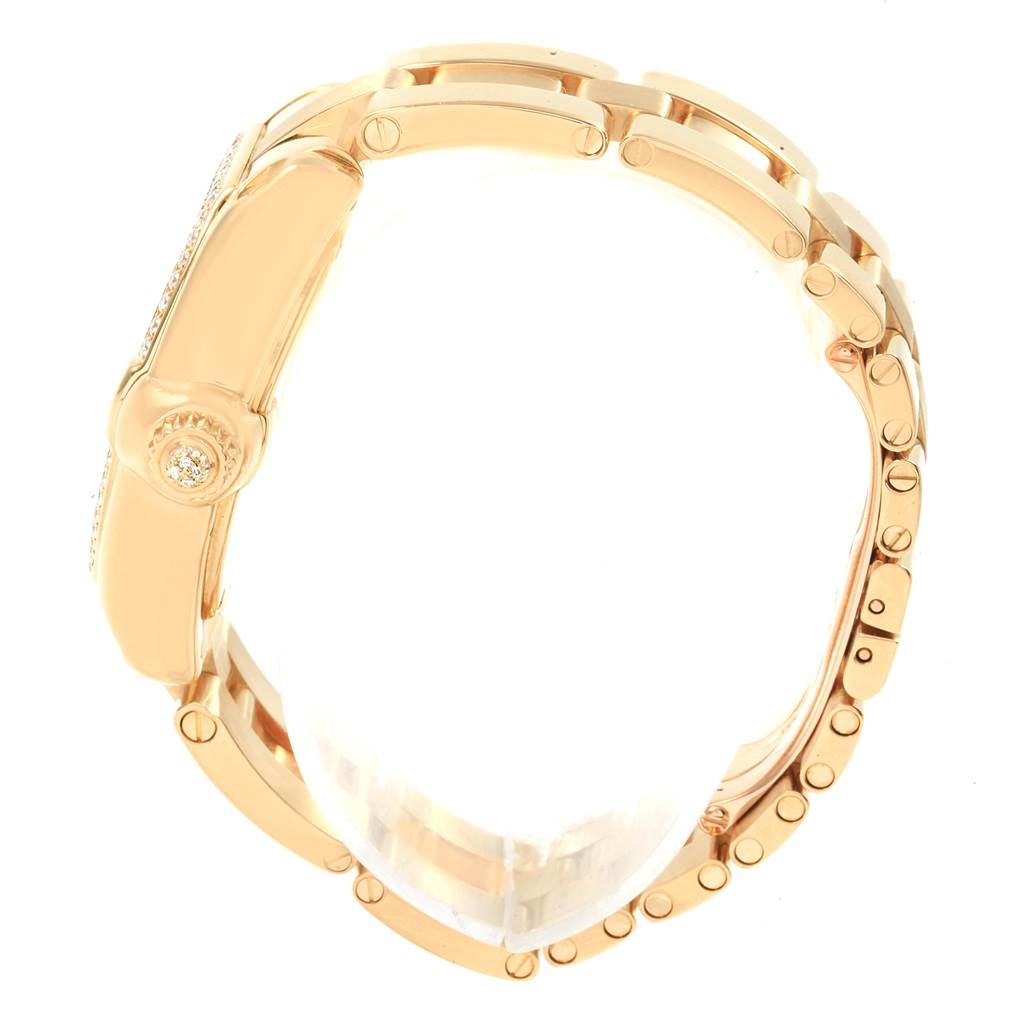 This image shows a side view of the Cartier Roadster WE5001X1 Women's Yellow Gold Silver Dial WE5001X1 Women's Yellow Gold Silver Dial watch, focusing on the bracelet, case, and crown with a diamond.