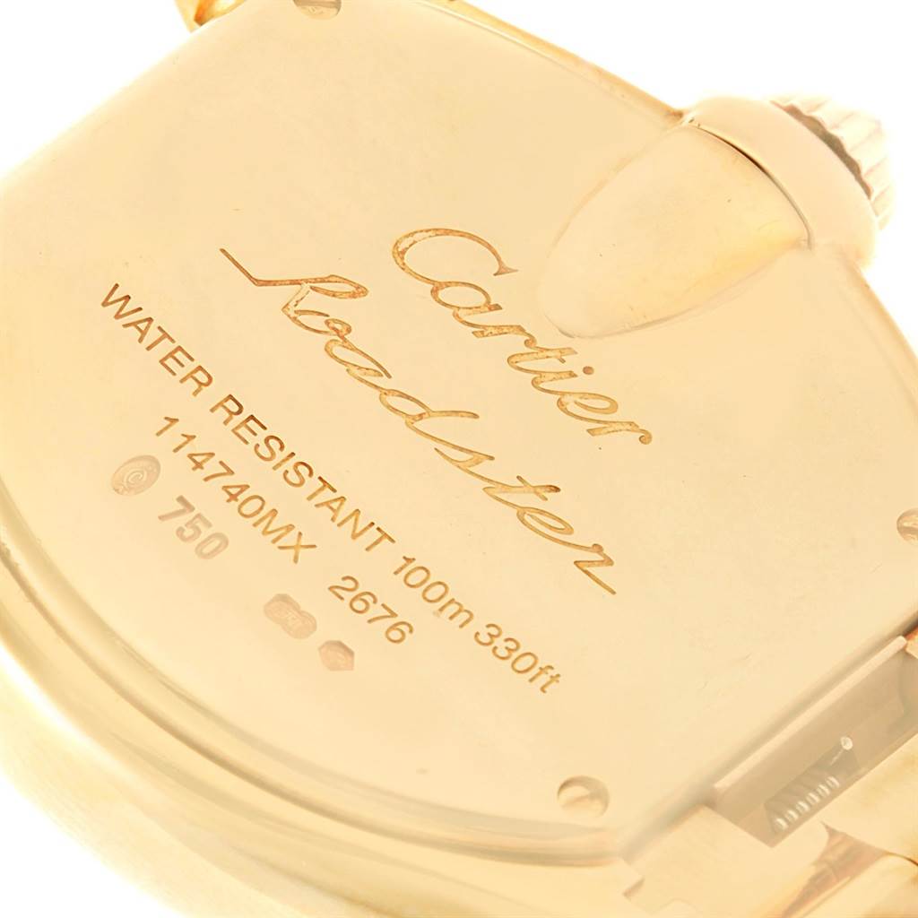 This close-up image displays the back case and crown of a Cartier Roadster WE5001X1 Women's Yellow Gold Silver Dial WE5001X1 Women's Yellow Gold Silver Dial watch.