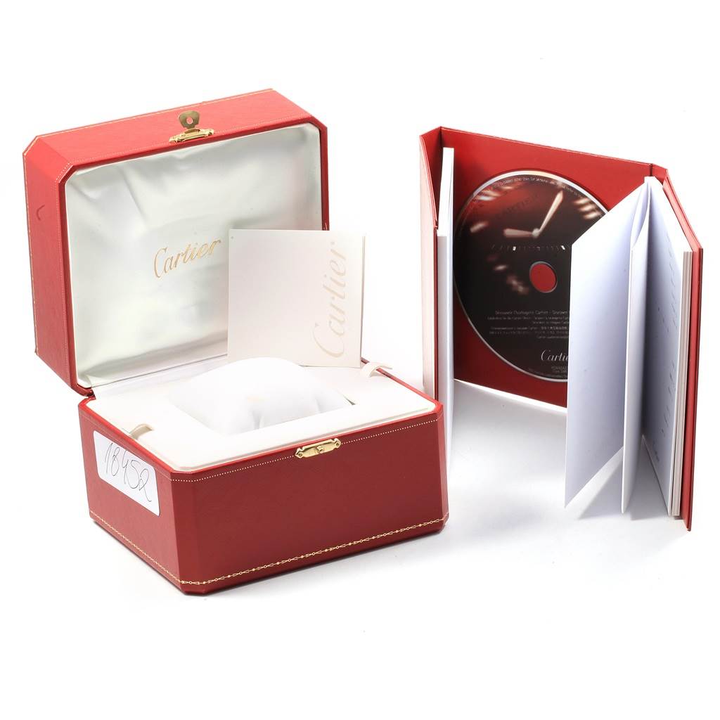 This image shows the packaging accessories for a Cartier Roadster W62017V3 Women
s Stainless Steel Pink Dial W62017V3 Women
s Stainless Steel Pink Dial model watch, including its box, booklet, and CD.