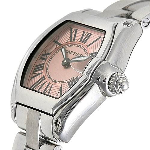 The image shows a close-up angle of the Cartier Roadster W62017V3 Women's Stainless Steel Pink Dial W62017V3 Women's Stainless Steel Pink Dial watch, highlighting its dial, crown, and part of the bracelet.