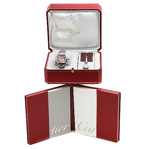 The image shows a Cartier Roadster W62017V3 Women's Stainless Steel Pink Dial W62017V3 Women's Stainless Steel Pink Dial model watch and accessories at a top-down angle inside a red and white presentation box.