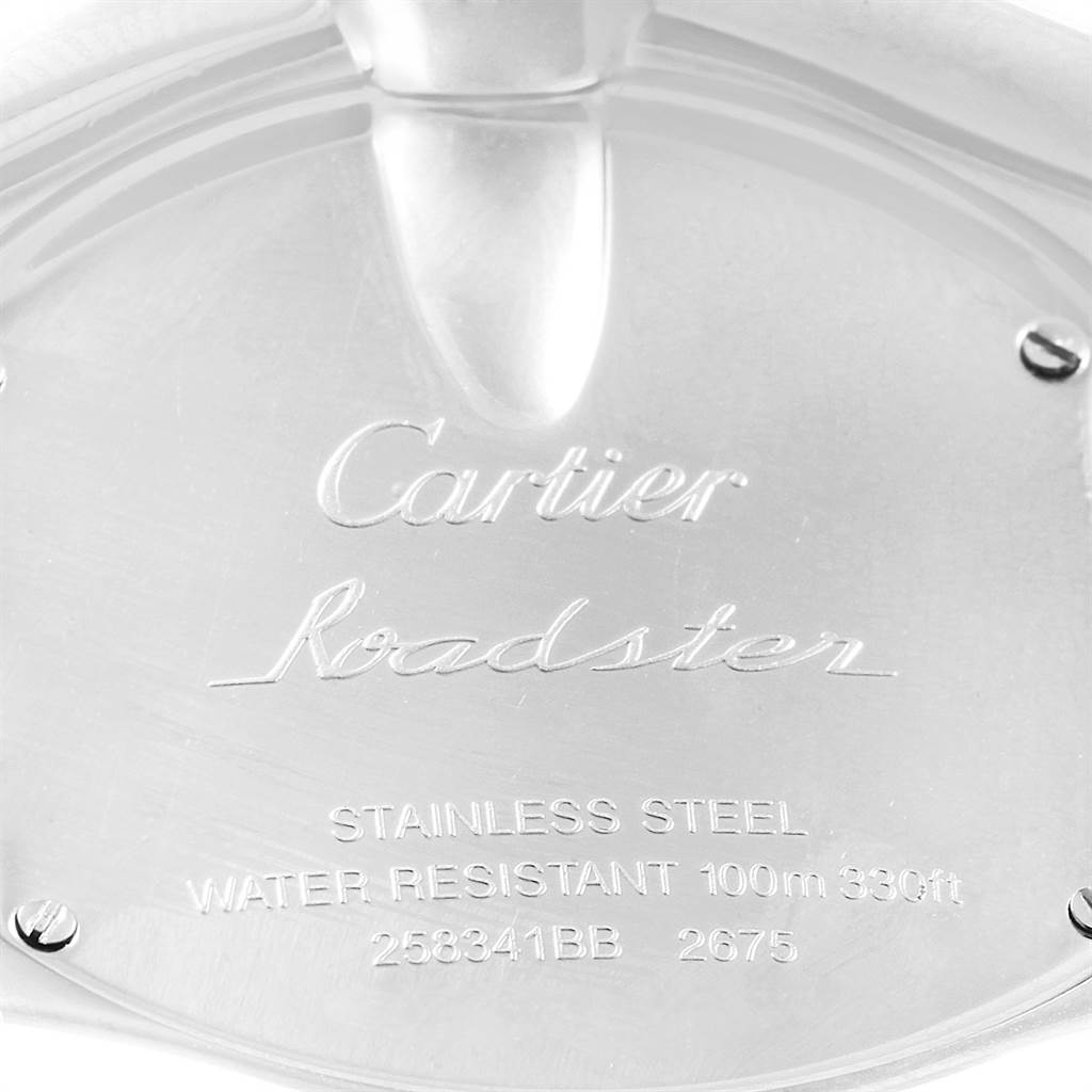 This image shows the case back of the Cartier Roadster W62016V3 Women
s Stainless Steel Silver Dial W62016V3 Women
s Stainless Steel Silver Dial watch, highlighting its engravings and screw detailing.