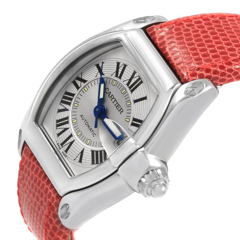 The image shows a close-up angle of the Cartier W62000V3 Stainless Steel Silver Dial W62000V3 Stainless Steel Silver Dial Roadster Men's Steel Red Strap Large Watch W62000V3, highlighting the dial and strap.