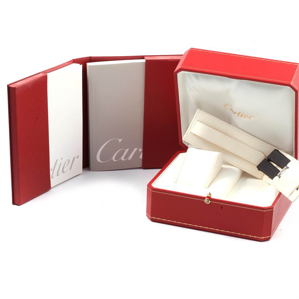 The image shows the packaging and accessories for a Cartier Roadster 17859 Women
s Stainless Steel Silver Dial 17859 Women
s Stainless Steel Silver Dial model watch, including the box and manual.