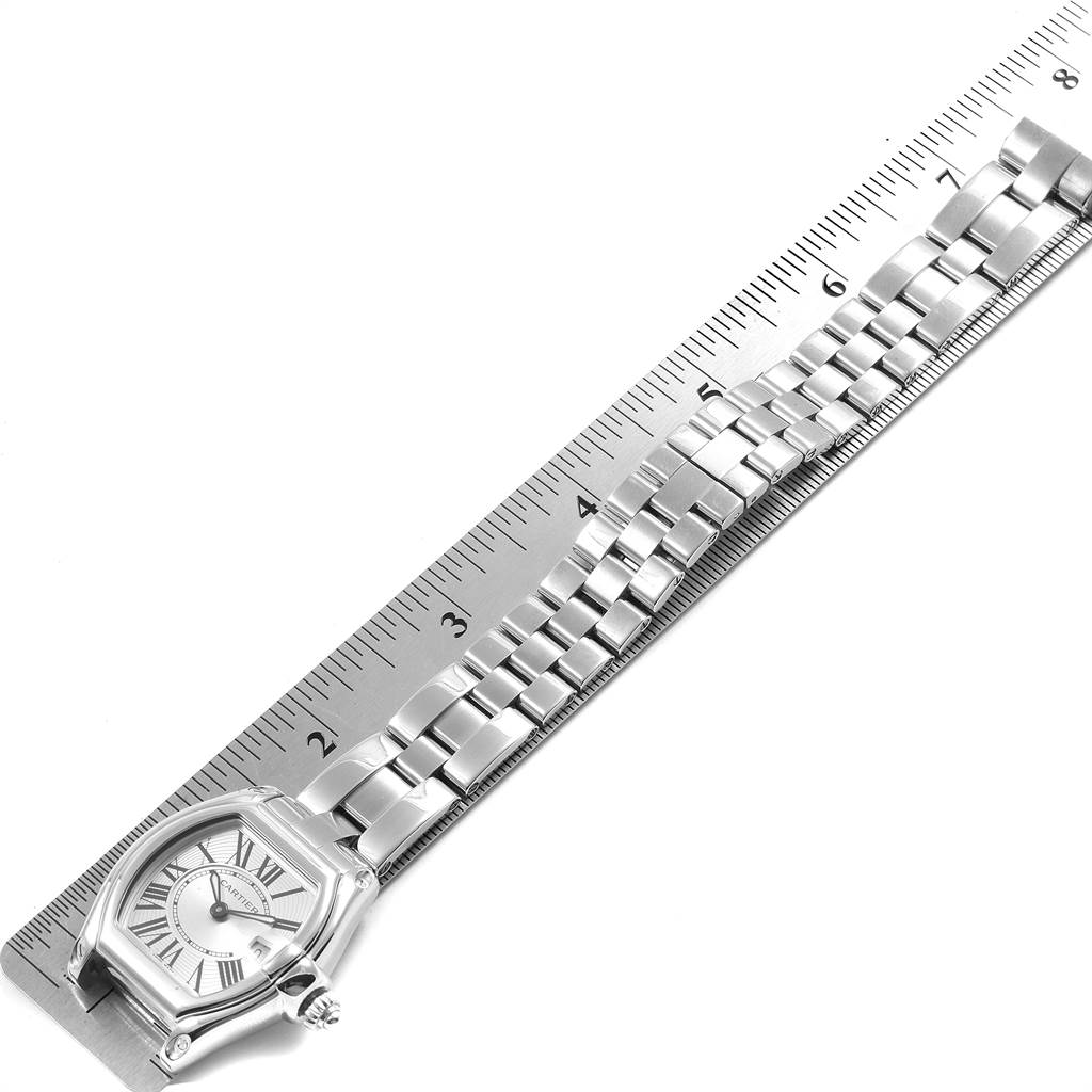 The image shows a top-down view of a Cartier Roadster 17859 Women
s Stainless Steel Silver Dial 17859 Women
s Stainless Steel Silver Dial watch with its metal bracelet measured against a ruler.
