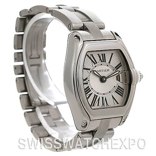 The image shows a Cartier Roadster W62016V3 Women
s Stainless Steel Silver Dial W62016V3 Women
s Stainless Steel Silver Dial watch from a slightly front-side angle, highlighting its case, bracelet, and dial.