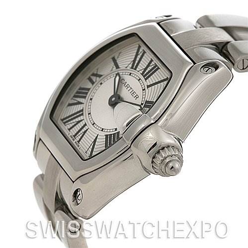 The image shows a side angle of the Cartier Roadster W62016V3 Women
s Stainless Steel Silver Dial W62016V3 Women
s Stainless Steel Silver Dial featuring part of the bracelet, crown, and dial with Roman numerals.