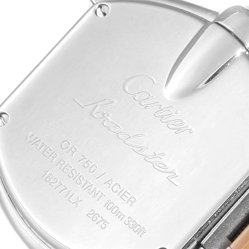 The image shows the case back of a Cartier Roadster W62026Y4 Women's Steel and Gold (two tone) Silver Dial W62026Y4 Women's Steel and Gold (two tone) Silver Dial watch with engraved details.