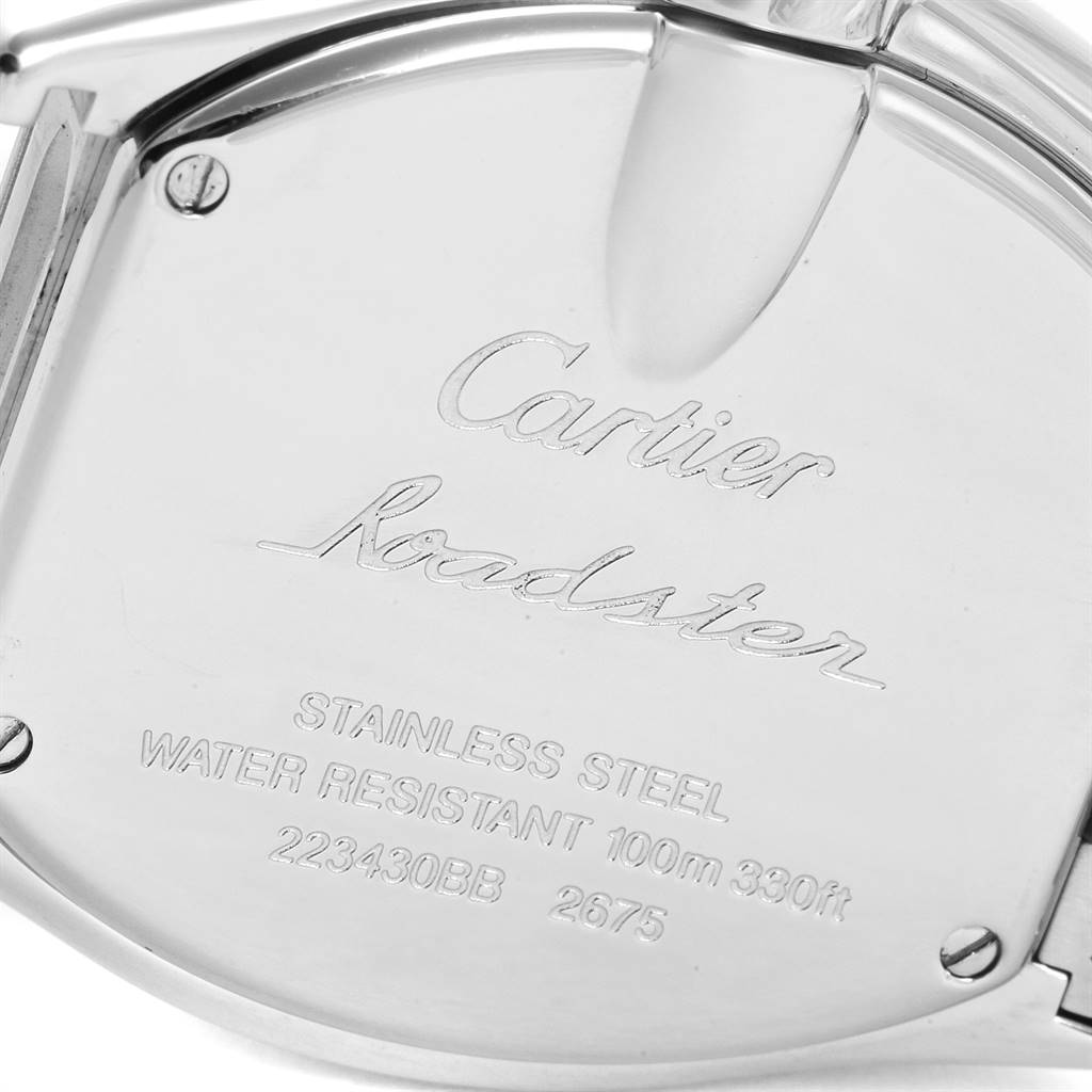This image shows the engraved stainless steel back of the Cartier Roadster W62017V3 Women's Stainless Steel Pink Dial W62017V3 Women's Stainless Steel Pink Dial watch from an angled view.