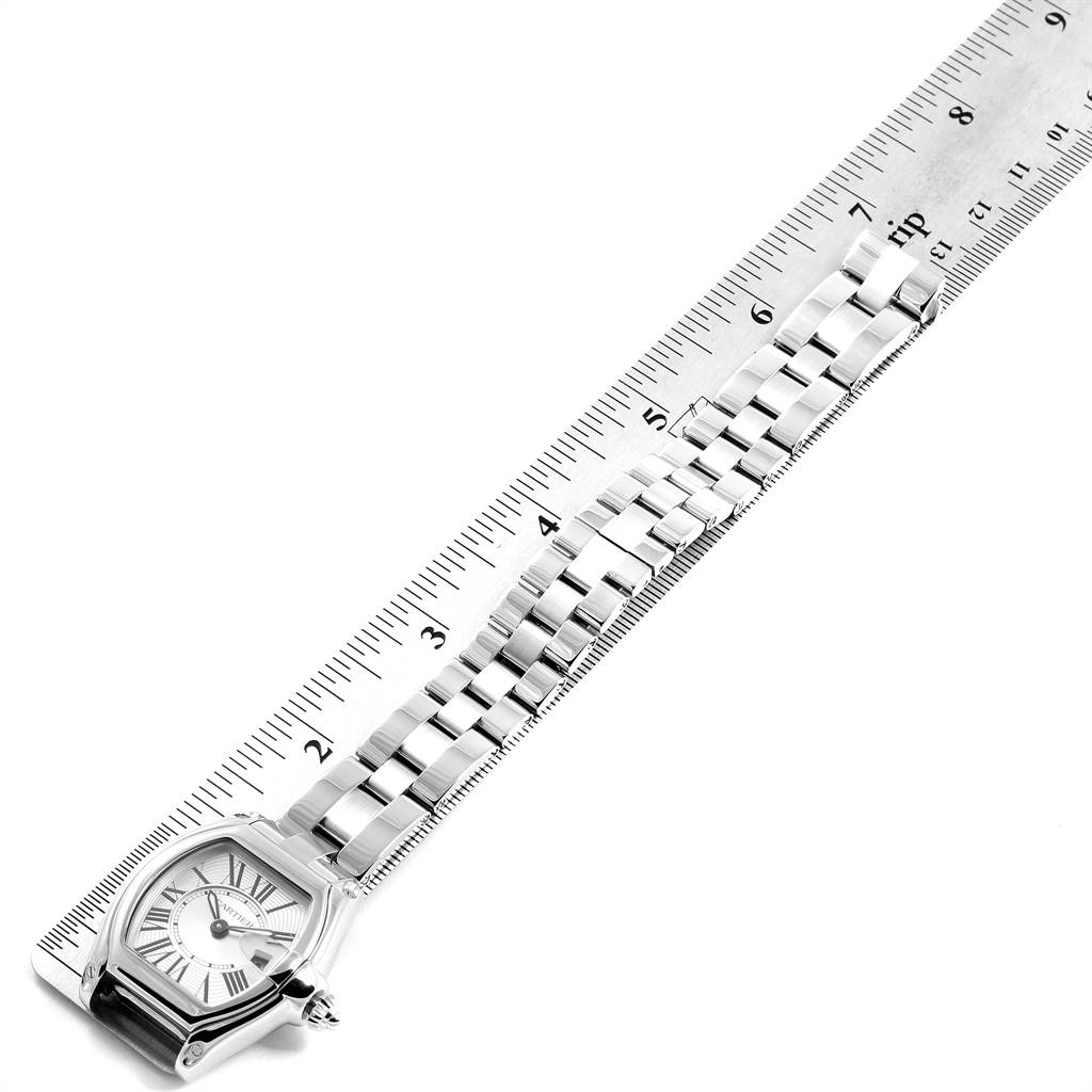 The Cartier Roadster W62016V3 Women
s Stainless Steel Silver Dial W62016V3 Women
s Stainless Steel Silver Dial model watch is shown from a top angle alongside a ruler to measure its bracelet length.