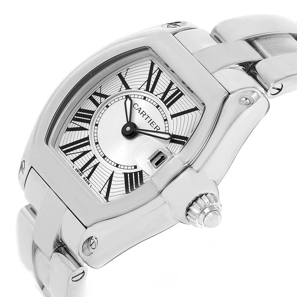 The image shows a close-up of the Cartier Roadster W62016V3 Women
s Stainless Steel Silver Dial W62016V3 Women
s Stainless Steel Silver Dial watch face, crown, and part of its bracelet at an angle.