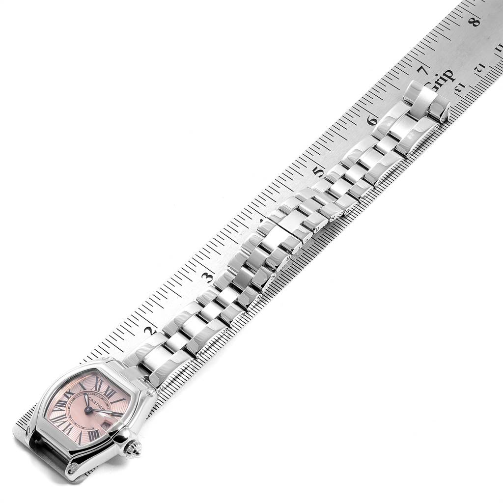 The image shows a top-down view of a Cartier Roadster W62017V3 Women's Stainless Steel Pink Dial W62017V3 Women's Stainless Steel Pink Dial watch with its bracelet measured against a ruler.