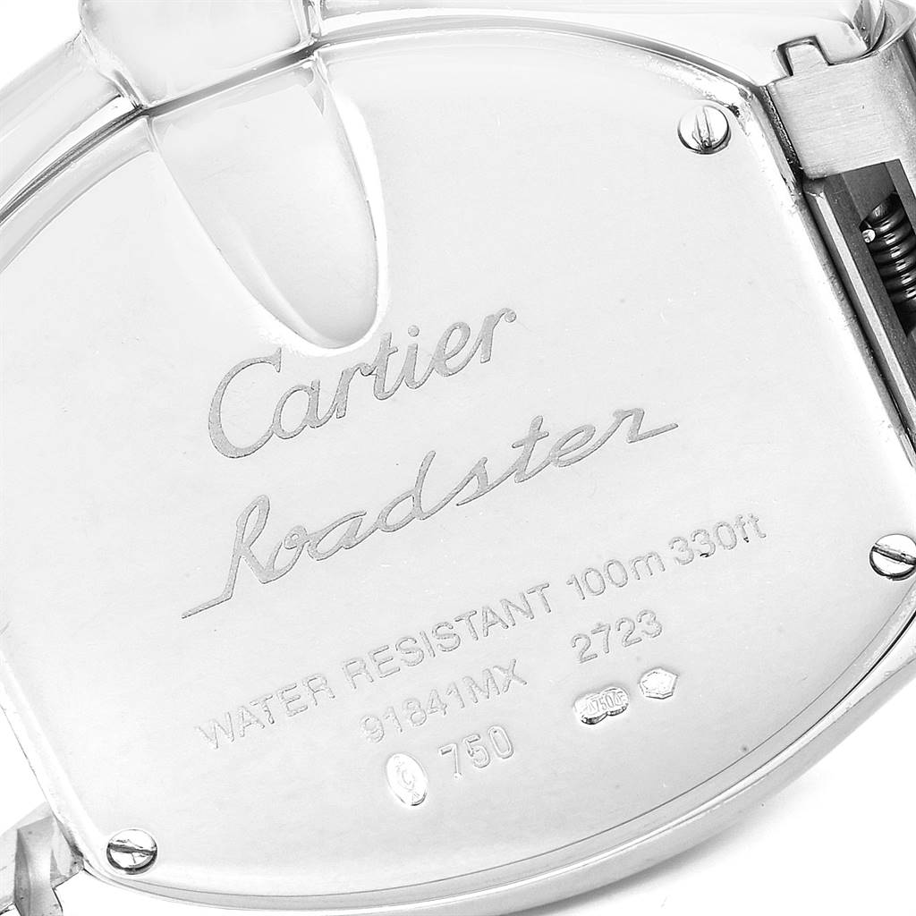 This image shows a close-up of the back case of the Cartier Roadster WE5002X2 Women's White Gold Silver Dial WE5002X2 Women's White Gold Silver Dial watch, featuring engraved details.