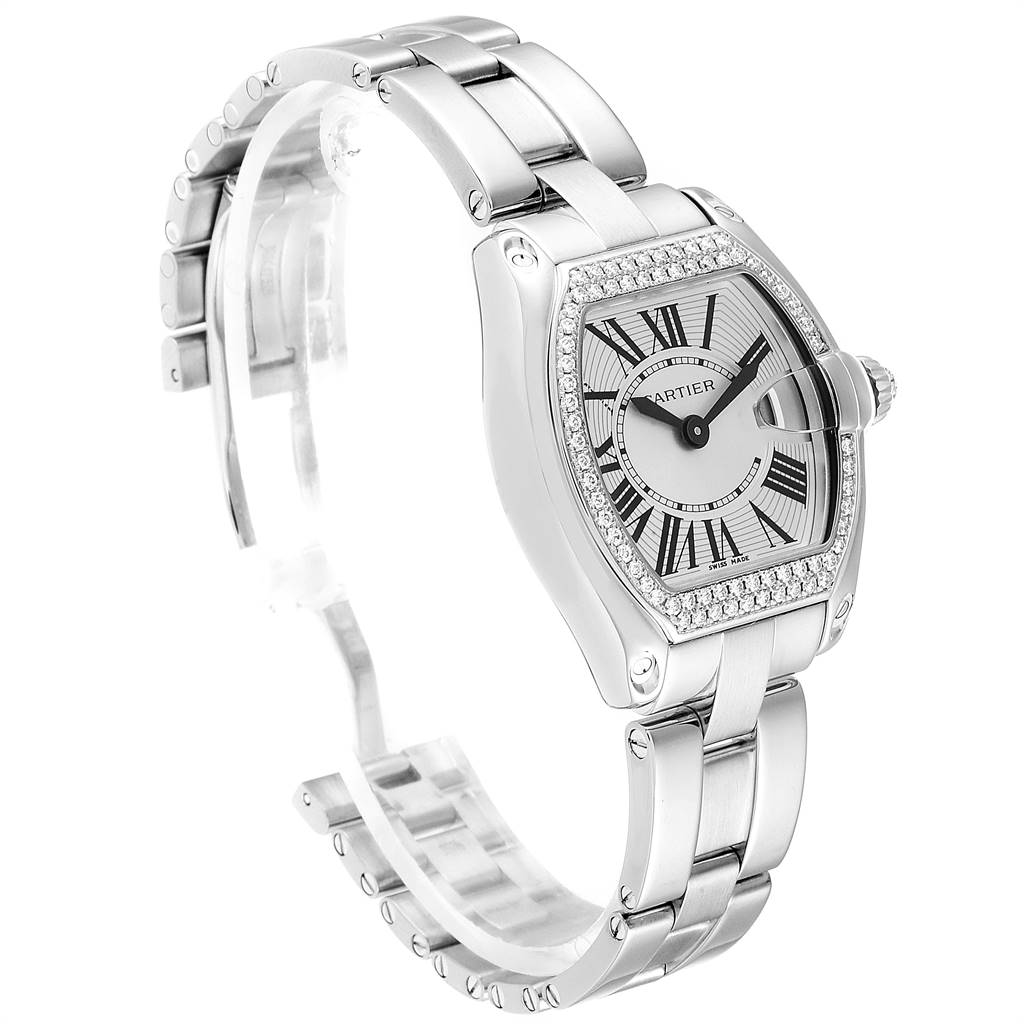 The image shows a Cartier Roadster WE5002X2 Women's White Gold Silver Dial WE5002X2 Women's White Gold Silver Dial watch from a three-quarter angle, highlighting the face, band, and clasp.