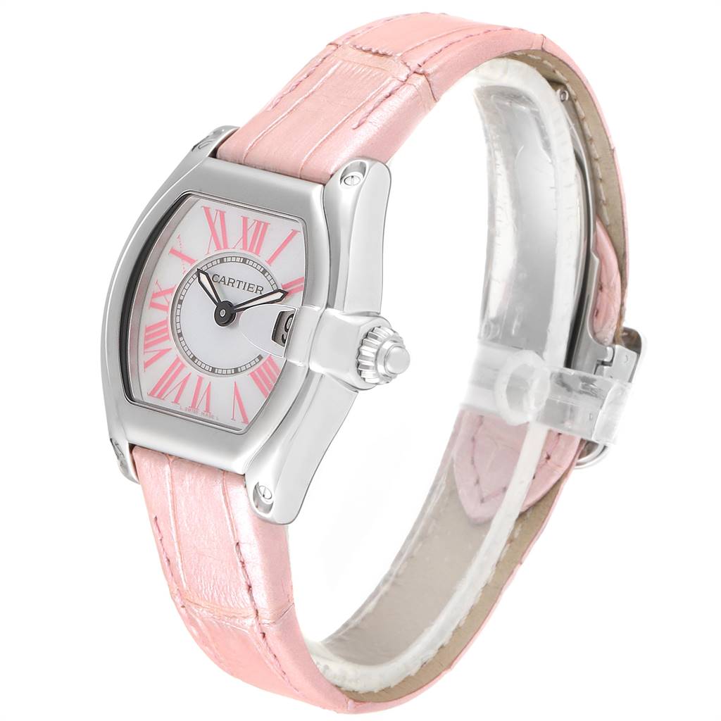 The image shows a Cartier Roadster W6206006 Women's Stainless Steel Mother of Pearl Dial W6206006 Women's Stainless Steel Mother of Pearl Dial watch at an angle highlighting the pink strap and watch face with pink Roman numerals.