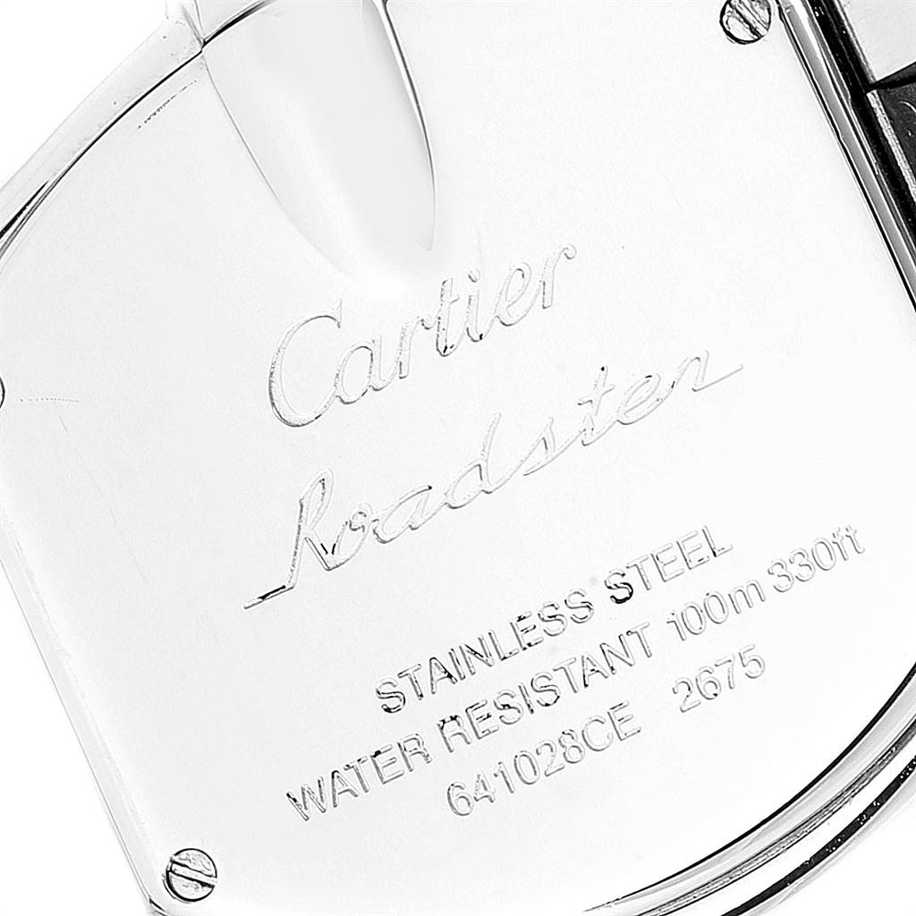 The image shows a close-up, angled view of the back case of a Cartier Roadster W62026Y4 Women's Steel and Gold (two tone) Silver Dial W62026Y4 Women's Steel and Gold (two tone) Silver Dial watch, highlighting the engraved details.