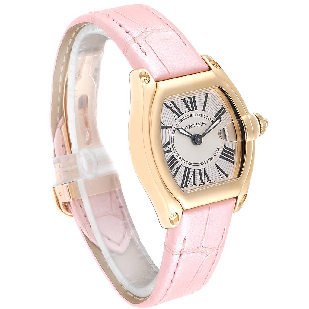 This image shows the Cartier Roadster W62018Y5 Women
s Yellow Gold Silver Dial W62018Y5 Women
s Yellow Gold Silver Dial watch angled to display its face, bezel, and pink leather strap.