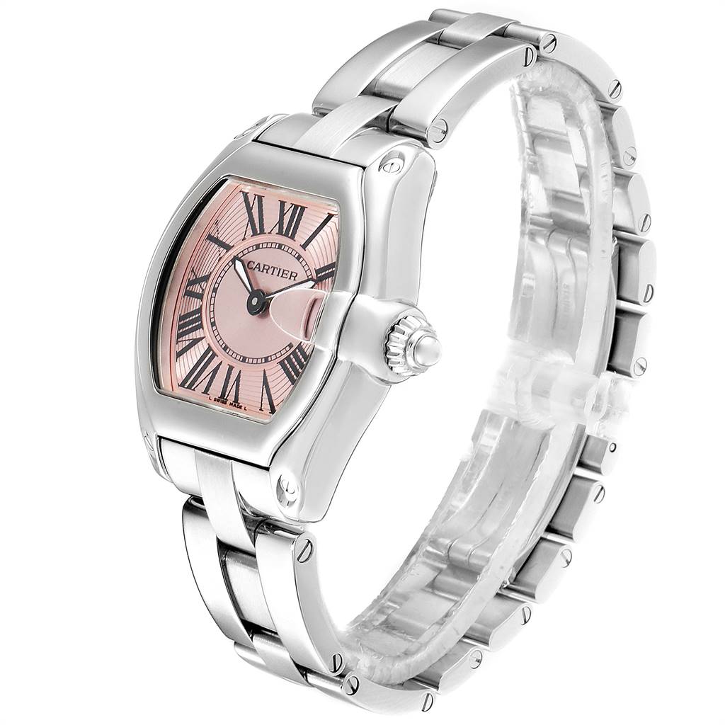 The image shows a Cartier Roadster W62017V3 Women's Stainless Steel Pink Dial W62017V3 Women's Stainless Steel Pink Dial watch at a tilted angle, displaying the face, crown, and bracelet.