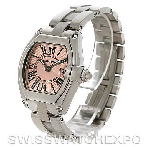 The image shows a Cartier Roadster W62017V3 Women's Stainless Steel Pink Dial W62017V3 Women's Stainless Steel Pink Dial model watch at a three-quarter angle, highlighting the watch face, date window, and stainless steel bracelet.