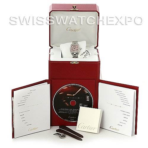 The image shows a Cartier Roadster W62017V3 Women's Stainless Steel Pink Dial W62017V3 Women's Stainless Steel Pink Dial watch with its box, manual, additional straps, and a CD from a front angle.