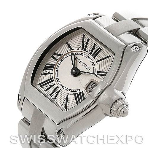 This image shows a close-up of the face, crown, and bracelet of a Cartier Roadster W62016V3 Women
s Stainless Steel Silver Dial W62016V3 Women
s Stainless Steel Silver Dial watch from an angled side view.