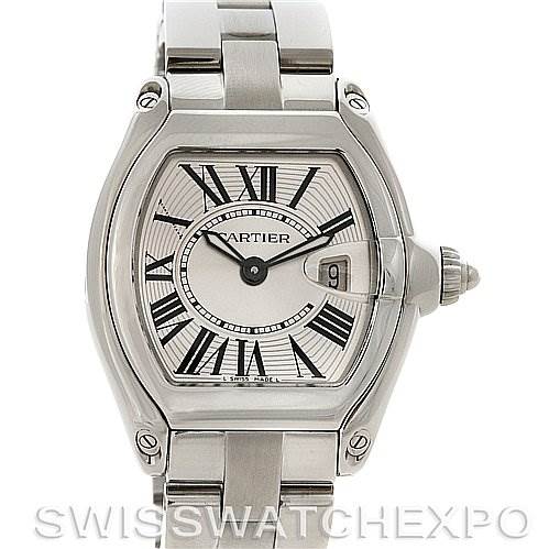 The image shows a top view of a Cartier Roadster W62016V3 Women
s Stainless Steel Silver Dial W62016V3 Women
s Stainless Steel Silver Dial watch, highlighting its dial, Roman numerals, date window, and metal bracelet.