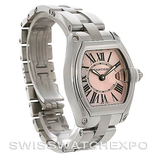The image shows a Cartier Roadster W62017V3 Women's Stainless Steel Pink Dial W62017V3 Women's Stainless Steel Pink Dial watch at a 3/4 angle displaying its face and metal bracelet.