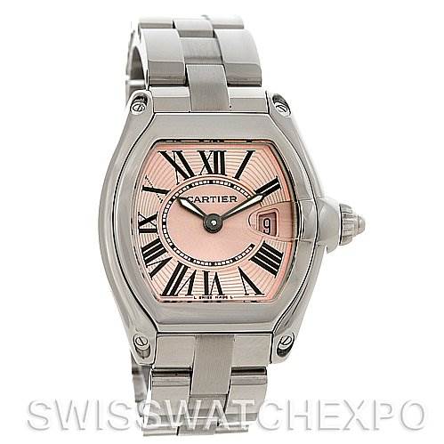 The image shows a frontal view of a Cartier Roadster W62017V3 Women
s Stainless Steel Pink Dial W62017V3 Women
s Stainless Steel Pink Dial watch, highlighting its pink dial, Roman numerals, and metal bracelet.
