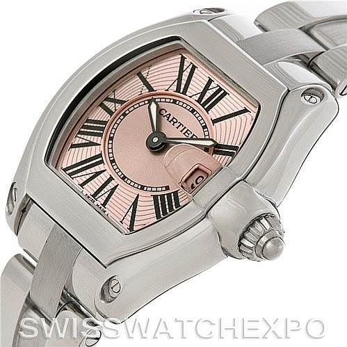 This image shows a close-up of the dial and crown of the Cartier Roadster W62017V3 Women
s Stainless Steel Pink Dial W62017V3 Women
s Stainless Steel Pink Dial watch at an angle.