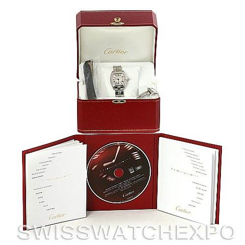 The image shows a Cartier Roadster W62016V3 Women
s Stainless Steel Silver Dial W62016V3 Women
s Stainless Steel Silver Dial watch in its box with accompanying booklets and a CD.