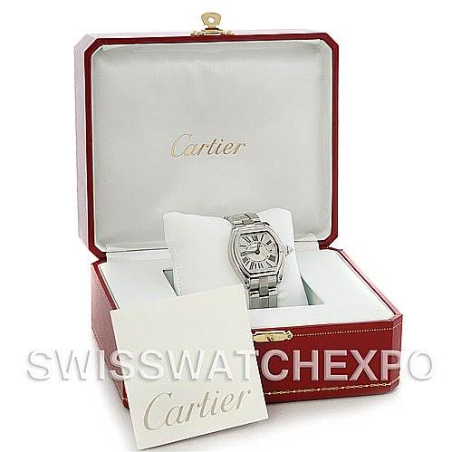 The Cartier Roadster W62016V3 Women
s Stainless Steel Silver Dial W62016V3 Women
s Stainless Steel Silver Dial watch is shown front-on in an open red box with branding and accompanying documentation.