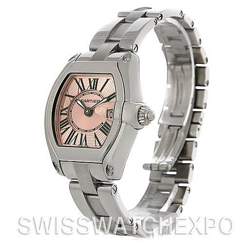 The image shows a Cartier Roadster W62017V3 Women's Stainless Steel Pink Dial W62017V3 Women's Stainless Steel Pink Dial watch at an angle, highlighting its face, bezel, crown, and bracelet.