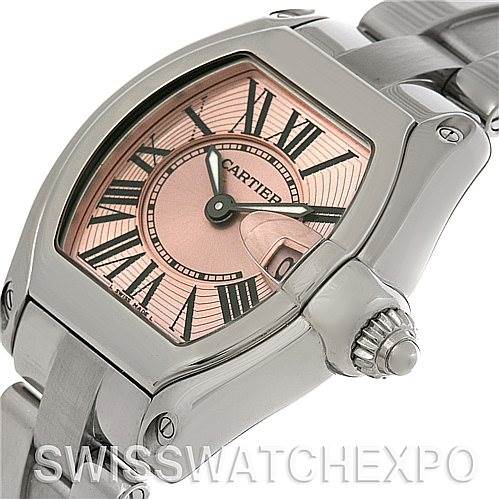 The image shows a Cartier Roadster W62017V3 Women's Stainless Steel Pink Dial W62017V3 Women's Stainless Steel Pink Dial watch from a front angle, focusing on the dial, crown, and part of the bracelet.