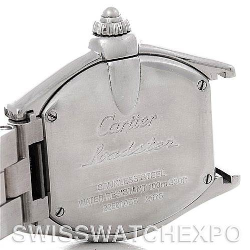 The image shows the back casing and crown of a Cartier Roadster W62016V3 Women
s Stainless Steel Silver Dial W62016V3 Women
s Stainless Steel Silver Dial watch, focusing on its stainless steel material and engraved details.