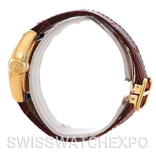 This image shows a Cartier Roadster W62018Y5 Women's Yellow Gold Silver Dial W62018Y5 Women's Yellow Gold Silver Dial watch from a side angle, highlighting the crown, case, and brown leather strap with a gold buckle.