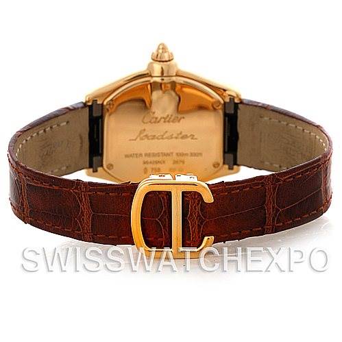 This is a rear angle view of a Cartier Roadster W62018Y5 Women's Yellow Gold Silver Dial W62018Y5 Women's Yellow Gold Silver Dial watch, showing the back case and leather strap with the Cartier logo on the clasp.