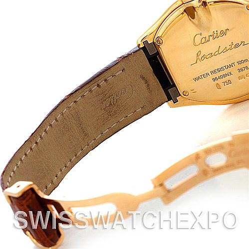 This image shows the back and strap of a Cartier Roadster W62018Y5 Women's Yellow Gold Silver Dial W62018Y5 Women's Yellow Gold Silver Dial watch, focusing on the clasp and inscriptions on the back cover.