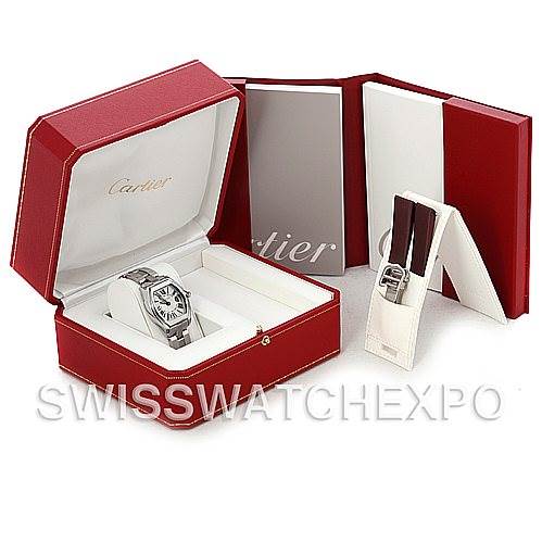 The image shows a Cartier Roadster W62016V3 Women
s Stainless Steel Silver Dial W62016V3 Women
s Stainless Steel Silver Dial watch at an angled view in its open red box, along with accompanying booklets and accessory box.
