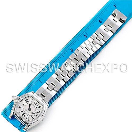 The image shows a Cartier Roadster W62016V3 Women's Stainless Steel Silver Dial W62016V3 Women's Stainless Steel Silver Dial watch laid flat over a ruler, highlighting the watch's face and full bracelet.