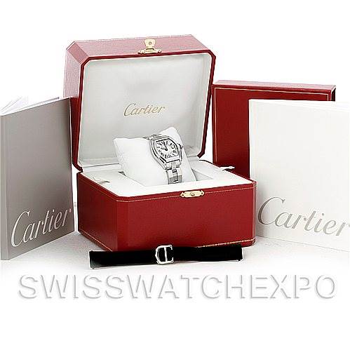 The Cartier Roadster W62016V3 Women
s Stainless Steel Silver Dial W62016V3 Women
s Stainless Steel Silver Dial watch is shown in its original red box, along with manuals and an extra strap.