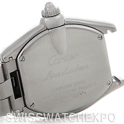 The image shows the back case and crown of a Cartier Roadster W62016V3 Women
s Stainless Steel Silver Dial W62016V3 Women
s Stainless Steel Silver Dial watch, including engraved details and part of the bracelet.