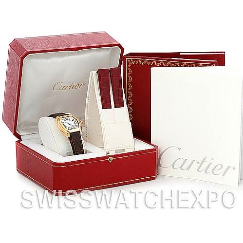 The image shows a Cartier Roadster W62018Y5 Women's Yellow Gold Silver Dial W62018Y5 Women's Yellow Gold Silver Dial watch with its box, case, and additional straps displayed from an elevated front angle.