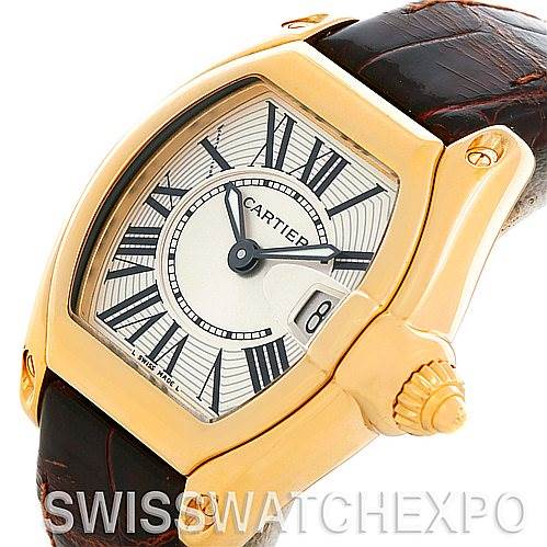 The image shows a Cartier Roadster W62018Y5 Women's Yellow Gold Silver Dial W62018Y5 Women's Yellow Gold Silver Dial model watch from an angled view focusing on the dial, bezel, crown, and part of the strap.