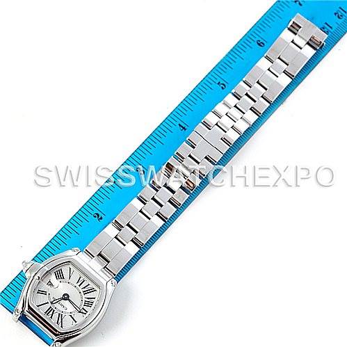 The image shows a top-down view of the Cartier Roadster W62016V3 Women
s Stainless Steel Silver Dial W62016V3 Women
s Stainless Steel Silver Dial watch with its full bracelet extended alongside a ruler for measurement.