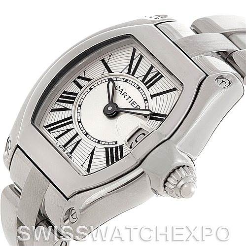 The image shows a close-up angle of the Cartier Roadster W62016V3 Women
s Stainless Steel Silver Dial W62016V3 Women
s Stainless Steel Silver Dial watch, highlighting its face, crown, and partial bracelet.