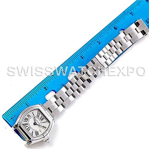 The image shows a Cartier Roadster W62016V3 Women
s Stainless Steel Silver Dial W62016V3 Women
s Stainless Steel Silver Dial watch laid flat next to a ruler, displaying both the face and metal band.