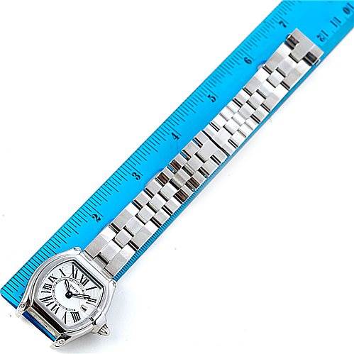 The image shows a top-down view of a Cartier Roadster W62016V3 Women's Stainless Steel Silver Dial W62016V3 Women's Stainless Steel Silver Dial watch, displaying the face, bezel, and metal bracelet alongside a ruler for scale.